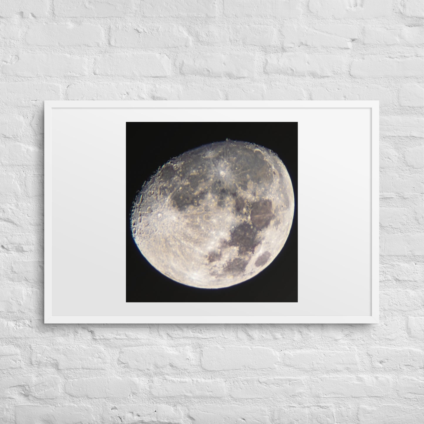 Minimalist astrophotography print titled 'Orbital Textures No. 12/31' featuring detailed lunar craters and moon dust in a black frame.
